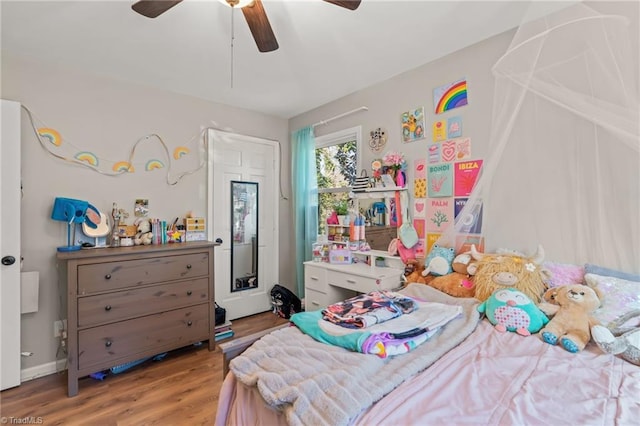 bedroom featuring hardwood / wood-style floors and ceiling fan