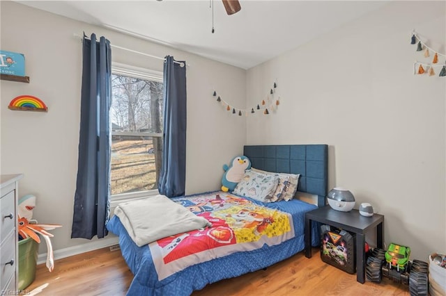 bedroom featuring light hardwood / wood-style floors and ceiling fan