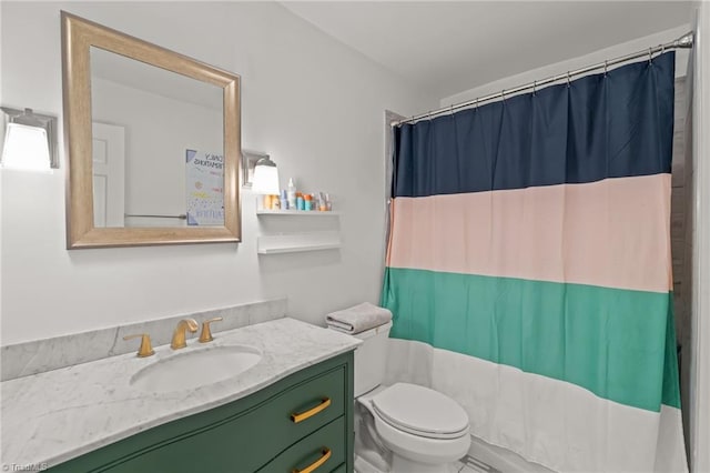 bathroom featuring vanity, toilet, and a shower with shower curtain