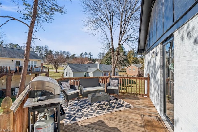 wooden terrace featuring an outdoor hangout area