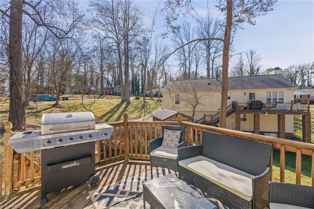 wooden terrace featuring a grill