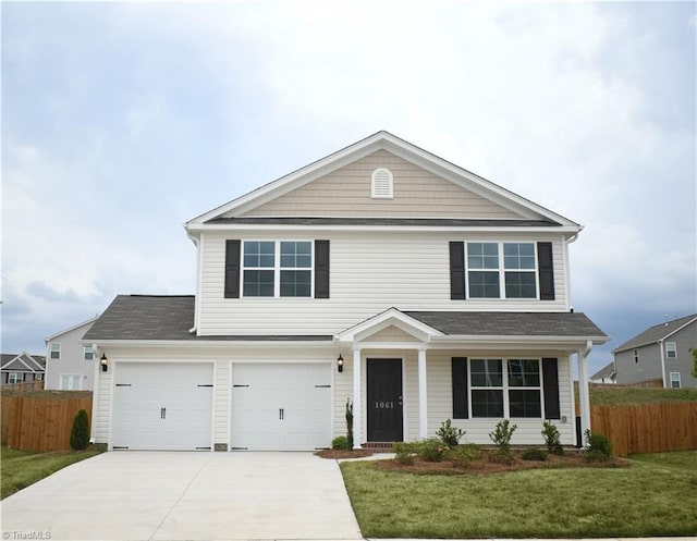 front of property featuring a garage and a front yard