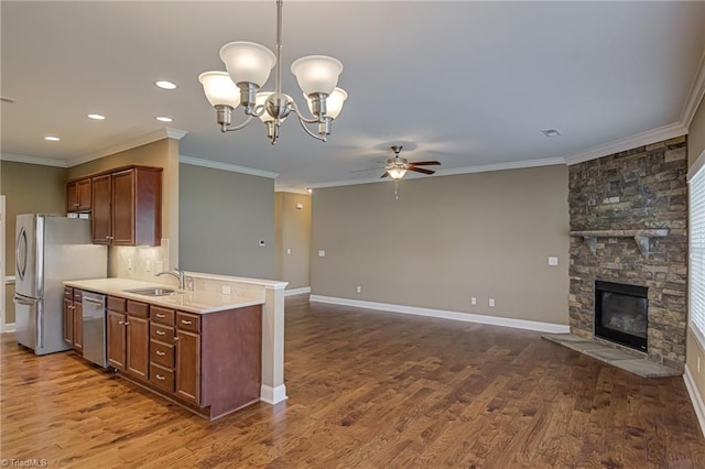 241 Collingswood Dr, Winston-Salem, NC 27127 - kitchen featuring a sink, appliances with stainless steel finishes, ceiling fan, open floor plan, and light countertops