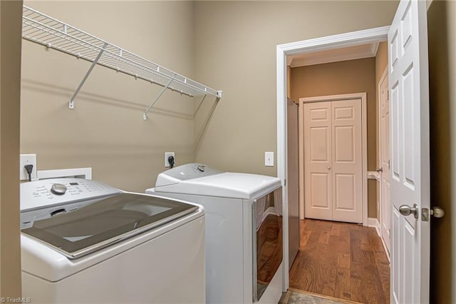 241 Collingswood Dr, Winston-Salem, NC 27127 - laundry area featuring washing machine and dryer and wood finished floors