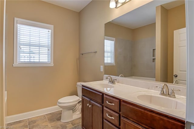 241 Collingswood Dr, Winston-Salem, NC 27127 - bathroom featuring double vanity, toilet, baseboards, and shower / bath combination