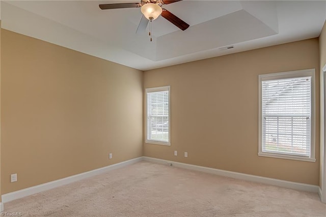 241 Collingswood Dr, Winston-Salem, NC 27127 - empty room with a raised ceiling, ceiling fan, light colored carpet, and baseboards