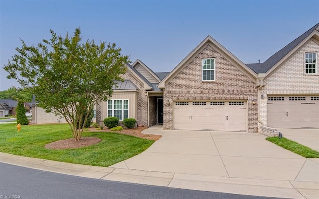 241 Collingswood Dr, Winston-Salem, NC 27127 - view of front of property with concrete driveway, brick siding, a front lawn, an attached garage, and board and batten siding