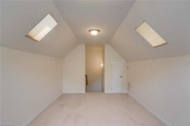 241 Collingswood Dr, Winston-Salem, NC 27127 - additional living space with light carpet, vaulted ceiling, and baseboards