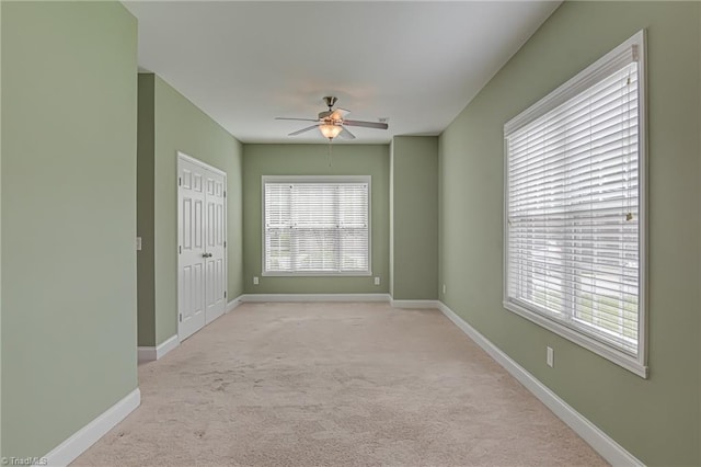 241 Collingswood Dr, Winston-Salem, NC 27127 - unfurnished room featuring light colored carpet, ceiling fan, and baseboards