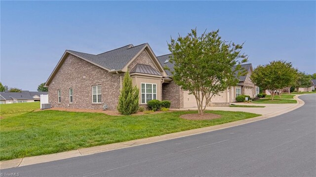 241 Collingswood Dr, Winston-Salem, NC 27127 - view of side of home featuring a garage, brick siding, a yard, central AC unit, and concrete driveway