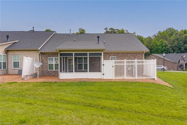 241 Collingswood Dr, Winston-Salem, NC 27127 - back of property with brick siding, a sunroom, a shingled roof, and a gate