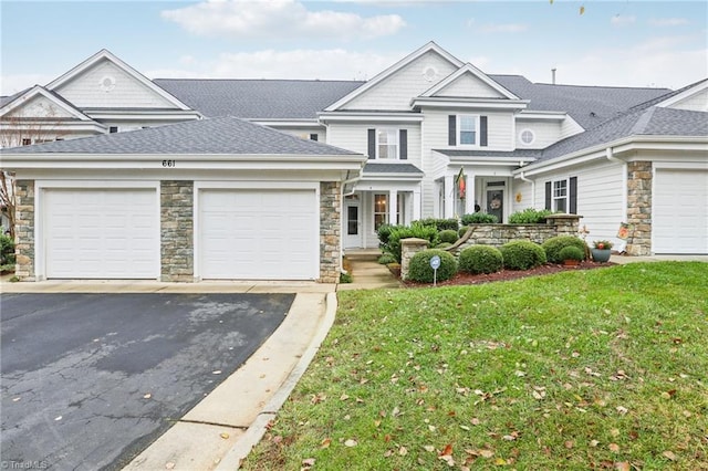 view of front facade featuring a garage and a front lawn