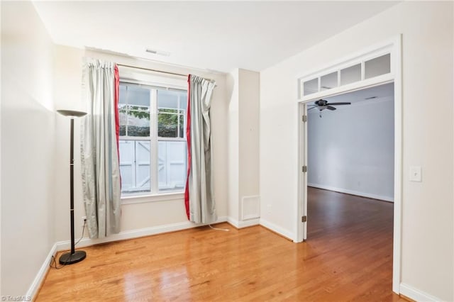 spare room featuring ceiling fan and wood-type flooring