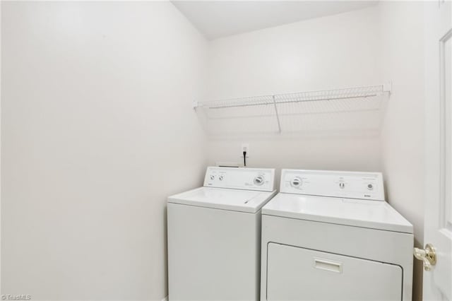 laundry room featuring washing machine and clothes dryer