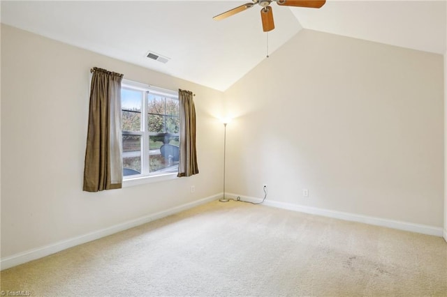 unfurnished room with ceiling fan, lofted ceiling, and carpet floors