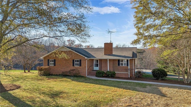 ranch-style home with a front lawn