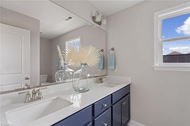 1416 Prospect Hill St, Kernersville, NC 27284 - bathroom with toilet, double vanity, and baseboards