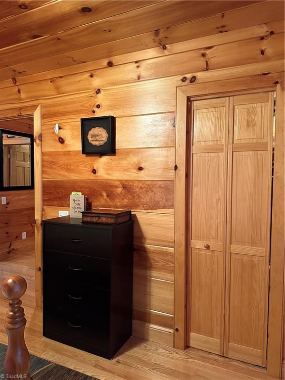 interior space featuring wooden walls