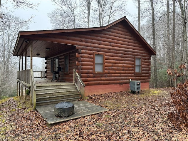 exterior space with central air condition unit and covered porch