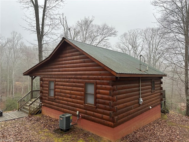 view of property exterior with central AC unit