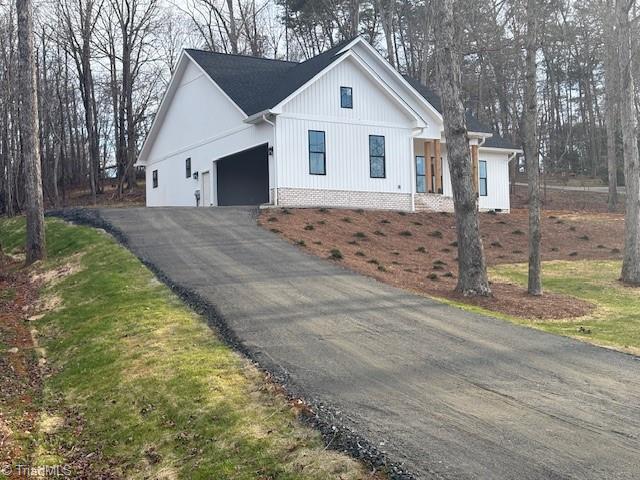115 Mountain Laurel Trl, Eden, NC 27288 - modern inspired farmhouse with a garage and asphalt driveway