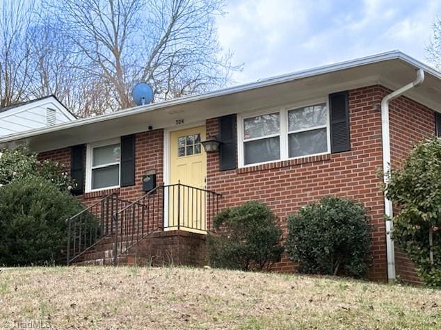 ranch-style house with brick siding