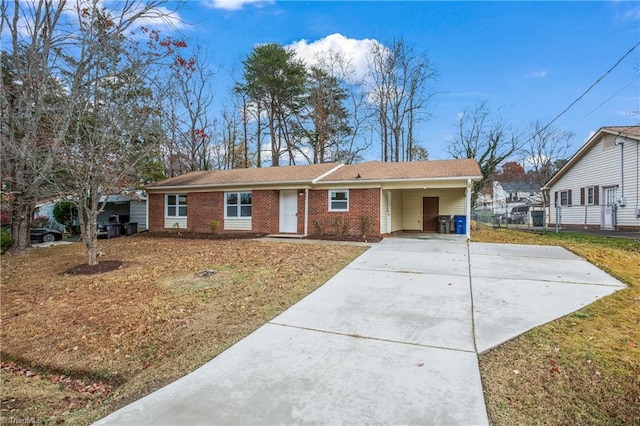 single story home with a carport and a front lawn