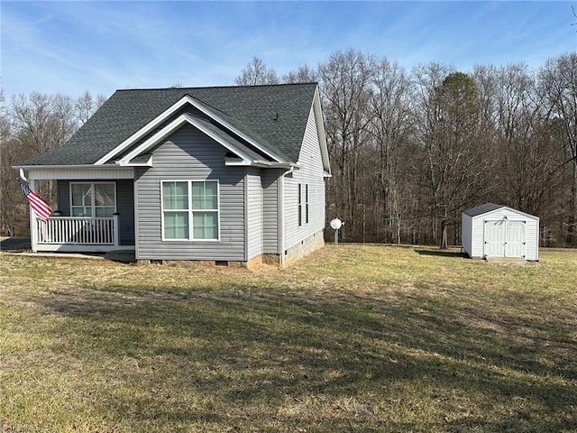 view of home's exterior featuring a porch, a lawn, and a shed