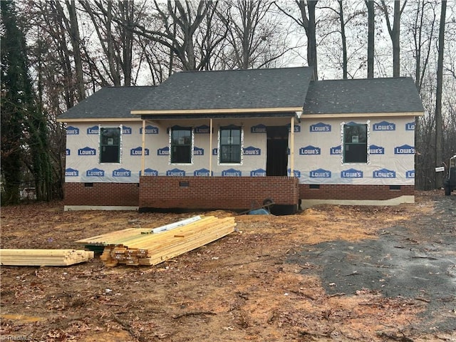 property under construction with a shingled roof and crawl space