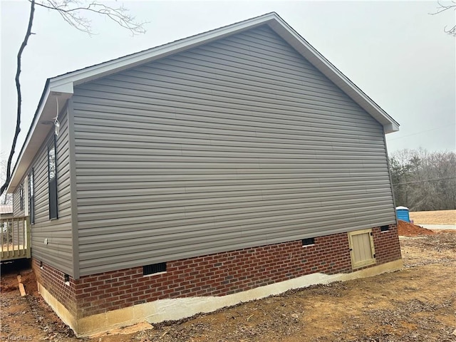 view of side of property featuring crawl space