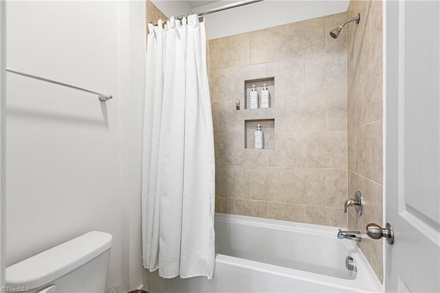 full bath with shower / tub combo and toilet