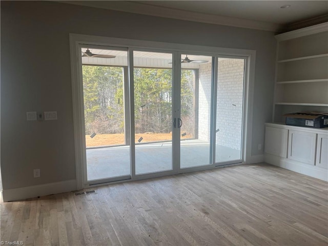 entryway featuring light hardwood / wood-style floors and built in features