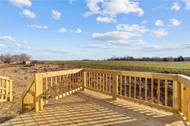 wooden deck featuring a rural view