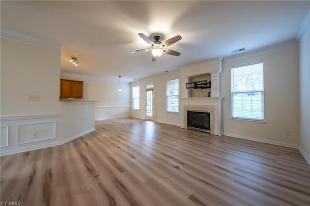 6015 Accord Ct, Pfafftown, NC 27040 - unfurnished living room with ornamental molding, a ceiling fan, a fireplace, and light wood-style floors