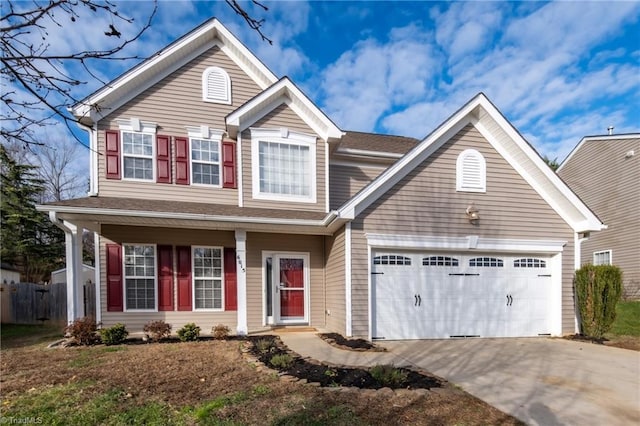 6015 Accord Ct, Pfafftown, NC 27040 - view of front facade with concrete driveway, a garage, and covered porch