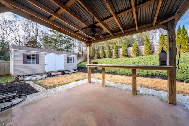 6015 Accord Ct, Pfafftown, NC 27040 - fenced backyard with a patio, a ceiling fan, and a shed