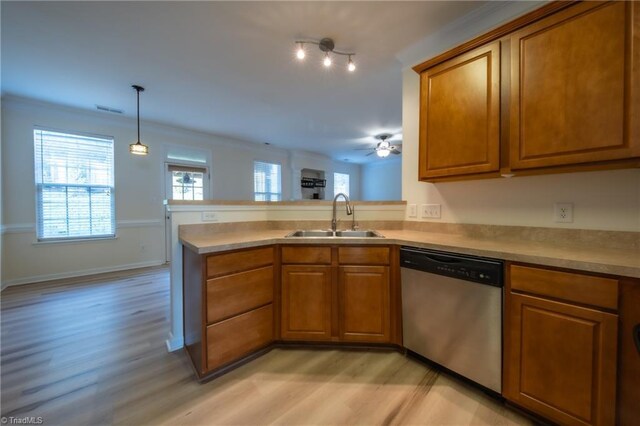6015 Accord Ct, Pfafftown, NC 27040 - kitchen with dishwasher, brown cabinetry, light wood-style floors, a peninsula, and light countertops