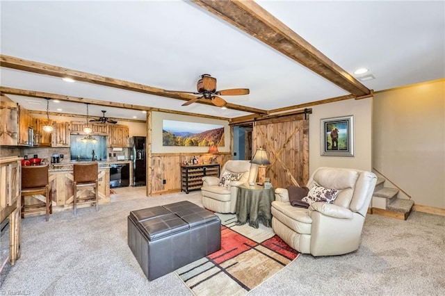 883 Wagon Ridge Ln, Ferguson, NC 28624 - living area with beamed ceiling, a barn door, light colored carpet, a ceiling fan, and recessed lighting
