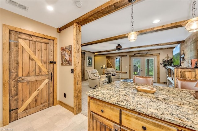 883 Wagon Ridge Ln, Ferguson, NC 28624 - kitchen featuring french doors, beam ceiling, a ceiling fan, light stone countertops, and hanging light fixtures