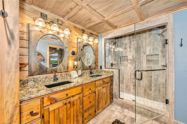 883 Wagon Ridge Ln, Ferguson, NC 28624 - bathroom featuring wood ceiling, a shower stall, double vanity, coffered ceiling, and wood finished floors