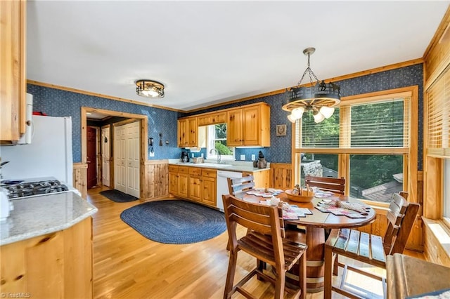883 Wagon Ridge Ln, Ferguson, NC 28624 - kitchen with wallpapered walls, a wainscoted wall, ornamental molding, light countertops, and white appliances