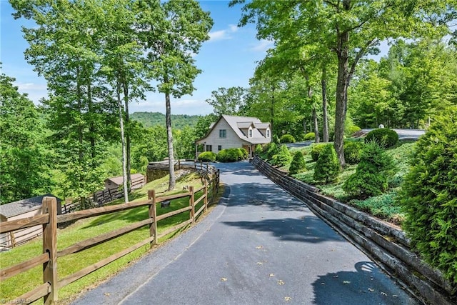 883 Wagon Ridge Ln, Ferguson, NC 28624 - view of community with driveway, fence, and a view of trees
