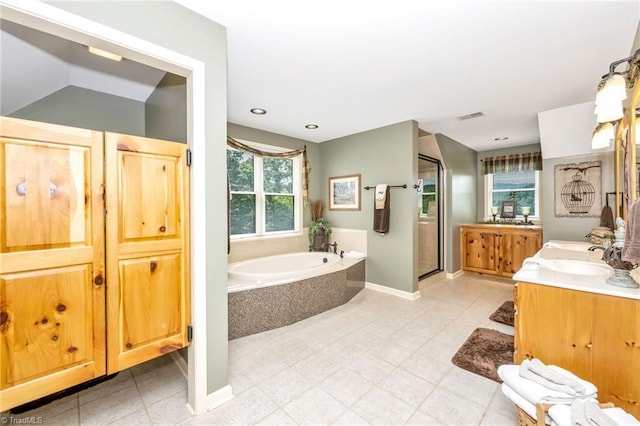 883 Wagon Ridge Ln, Ferguson, NC 28624 - bathroom featuring a stall shower, a bath, vanity, and baseboards