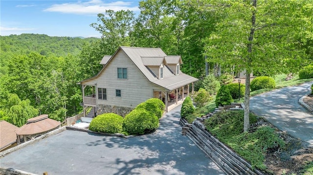 883 Wagon Ridge Ln, Ferguson, NC 28624 - view of front facade with stairs, a porch, and a forest view