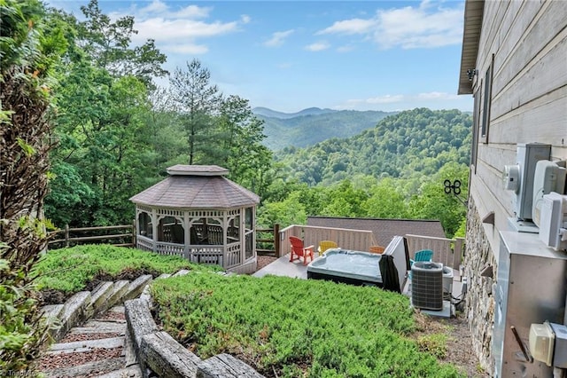 883 Wagon Ridge Ln, Ferguson, NC 28624 - view of yard featuring a gazebo, central AC unit, a forest view, a mountain view, and fence