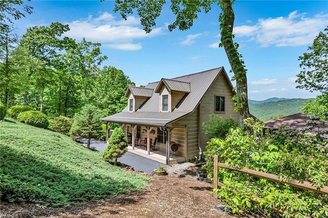 883 Wagon Ridge Ln, Ferguson, NC 28624 - view of front of home with metal roof and covered porch