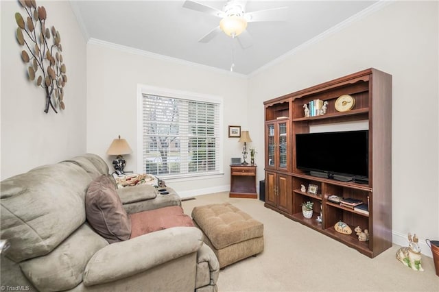 carpeted living room with ceiling fan and crown molding