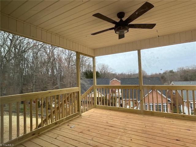 wooden deck with a ceiling fan