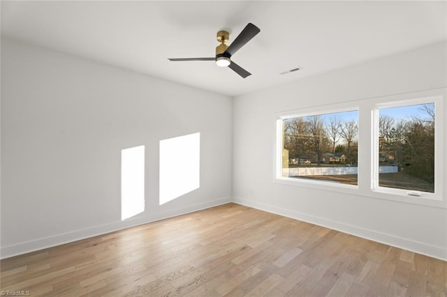 spare room with ceiling fan and light hardwood / wood-style floors