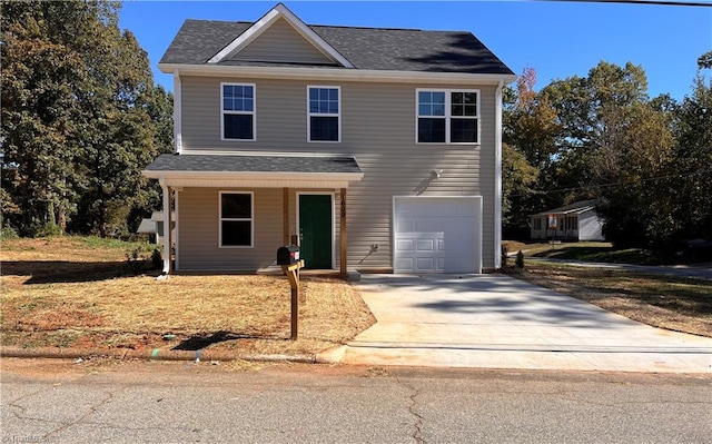 view of property with covered porch and a garage